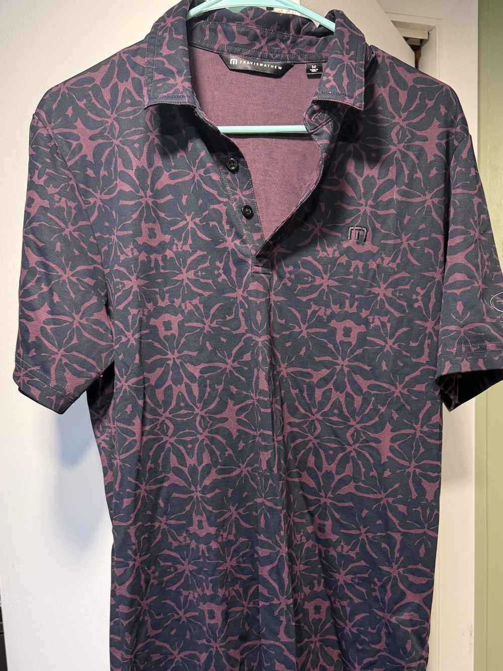 TravisMathew Men's Polo in Plum and Charcoal Floral Print